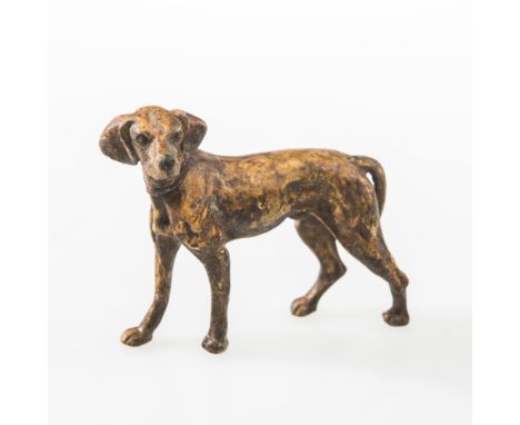 AN AUSTRIAN COLD PAINTED BRONZE OF A HOUND WITH A RED COLOUR, CIRCA 1900, height 8cm 