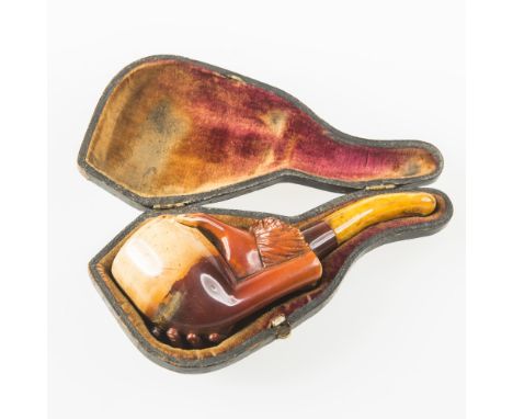 A 19th CENTURY MEERSCHAUM PIPE, decorated with a hand grasping the bowl and with amber mouth piece, (cased)