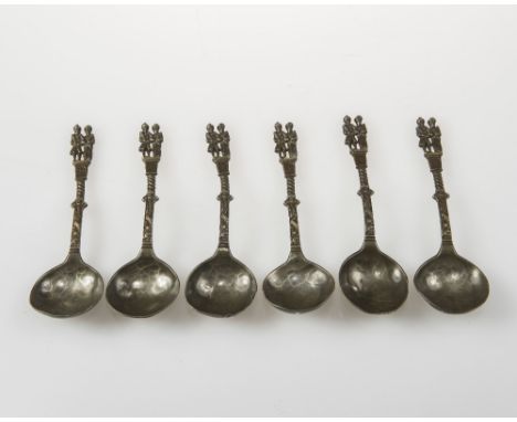 A SET OF SIX UNUSUAL 18th CENTURY SPOONS, possibly Dutch silver, each with a double figure finial, fluted and embossed shafts