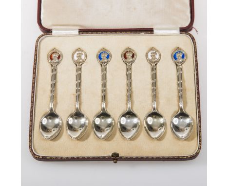 A CASED SET OF SIX SILVER COMMEMORATIVE TEASPOONS BY WILLIAM HAIR HASELER, Birmingham 1937, the terminals decorated in differ