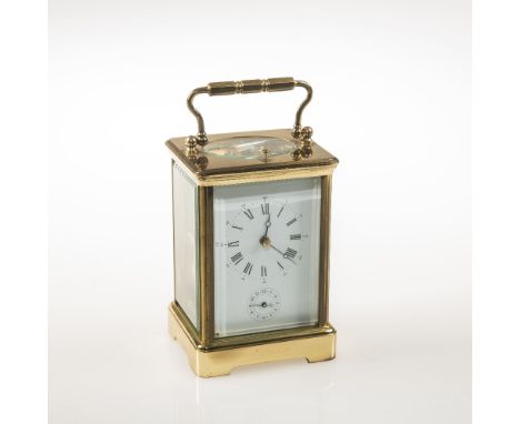 A 20TH CENTURY FRENCH GILT BRASS REPEATING AND STRIKING CARRIAGE CLOCK WITH ALARM, and key, the white enamel dial with Roman 