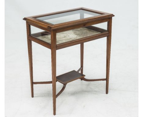 A LATE 19th CENTURY INLAID MAHOGANY BIJOUTERIE TABLE, the rectangular top with bevelled glass, raised on tapering square sect