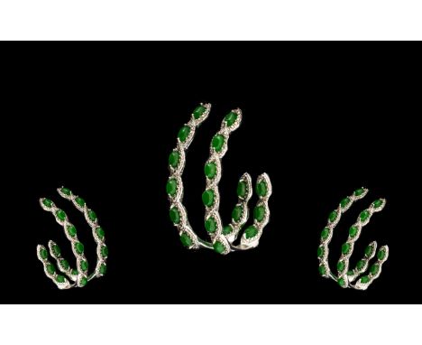 Green Jade Elongated J-Hoop Earrings, each earring having six marquise cut green jade set to the front of the hoop and a furt