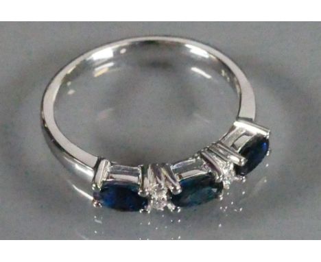 9ct white gold ladies ring set with 3 Sapphires and Diamonds: Size N, 2.5g.