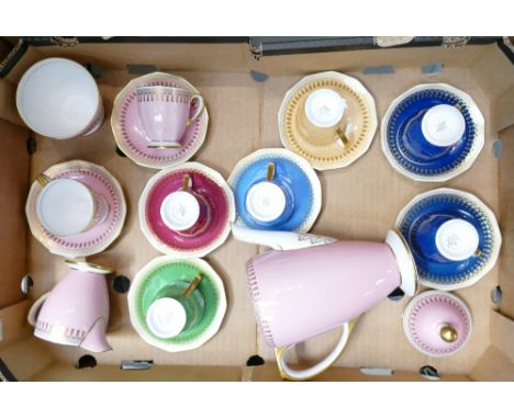 A Spode Ryde Harlequin coffee set: Comprising of coffee pot, sugar bowl, cream jug and eight multi coloured coffee cans and s