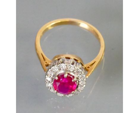 Ruby & Diamond cluster set 18ct gold ring: Ruby measures 8mm x 6mm approx.  Size L.                                  