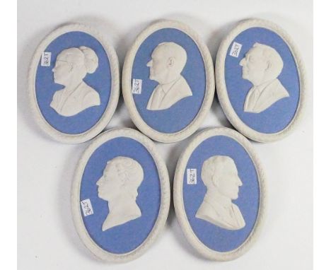A collection of Wedgwood blue portrait plaques including: Robert Henderson, Dr Janet Briggs, Brainerd Fischer Phillipson, Wil