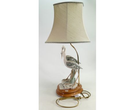 Capo di Monte bisque porcelain table lamp modelled as two herons: On an oval turned beechwood base, height excluding base &am