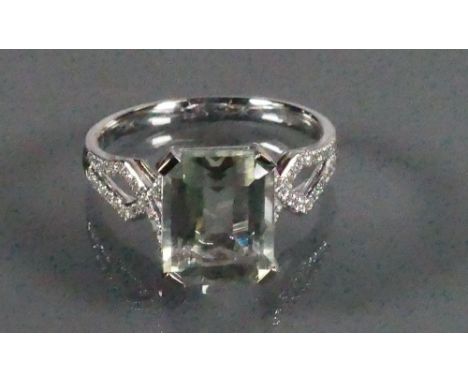 9ct White gold ladies Diamond dress ring set with large Aquamarine: Size P/Q, 3.3g.