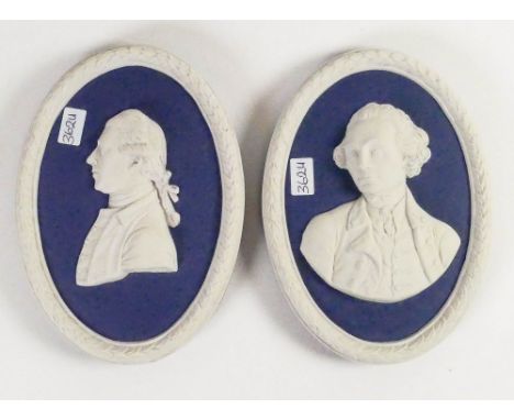 Wedgwood Blue Jasper oval portrait plaques Sir J Banks &amp; Captain Cook: Both dated 1974, height of largest 11cm. (2)