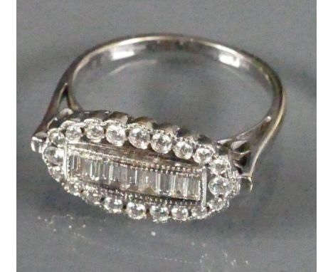 18ct White gold ladies ring centre set with 9 baguette diamonds surrounded by round cut diamonds: Size M, 4.5g.