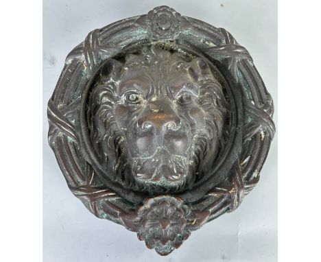 A LARGE ANTIQUE BRONZE LION HEAD DOOR KNOCKER, 24cm D 
