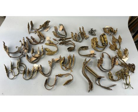 ARCHITECTURAL SALVAGE: A LARGE COLLECTION OF PAIRS OF FRENCH ROCOCCO CURTAIN POLE SUPPORTS, Over 25 pairs in total. Many stam