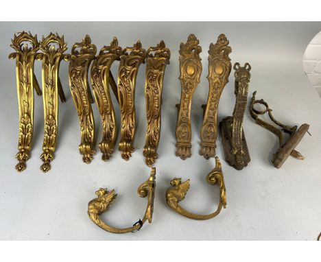 ARCHITECTURAL SALVAGE: SIX PAIRS OF ANTIQUE CURTAIN POLE SUPPORTS PROBABLY FRENCH ROCOCCO, WINGED GRIFFIN, RIBBON DESIGNS (12