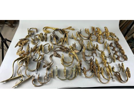 ARCHITECTURAL SALVAGE: A LARGE COLLECTION OF PAIRS OF FRENCH ROCOCCO CURTAIN POLE SUPPORTS, Over 25 pairs. Largest 30cm L 