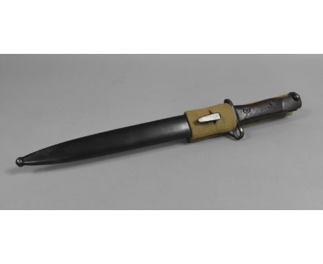 A Wooden Handled Bayonet in Metal Scabbard 