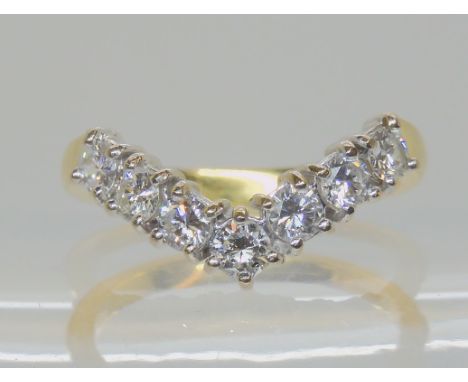 AN 18CT GOLD 'V' SHAPED DIAMOND RING set with estimated approx 0.70cts of brilliant cut diamonds, finger size M, weight 3.6gm