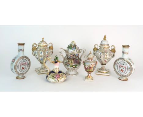 A PAIR OF CONTINENTAL PORCELAIN URNS each decorated with strings of flowers and gilt dot and dash design, gilt M and Crown ma