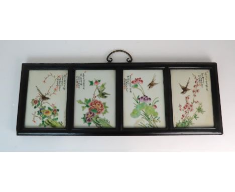 A CHINESE TILE PAINTING the four tiles painted with birds amongst flowers and script, signed, each tile 19 x 13cm, overall 23