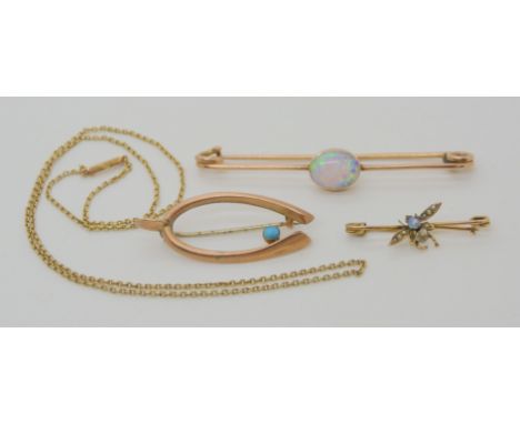 THREE VINTAGE BROOCHES AND A CHAIN a yellow metal mounted good white opal brooch, length 6.9cm. Dimensions of the opal 8mm x 