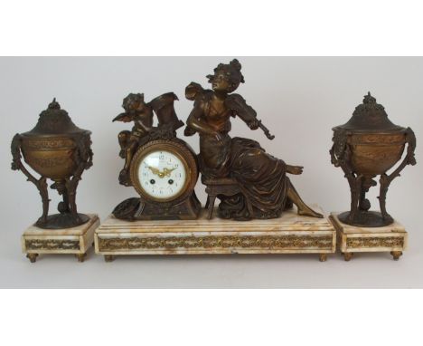 A FRENCH GILDED SPELTER AND ONYX MANTLE CLOCK GARNITURE the top mounted with maiden playing a violin, with a cherub beside he
