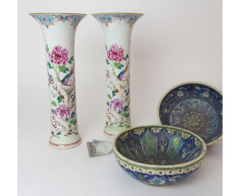 A PAIR OF CHINESE FAMILLE ROSE TRUMPET VASESeach painted with exotic birds on rockwork amongst peonies and beneath butterflie