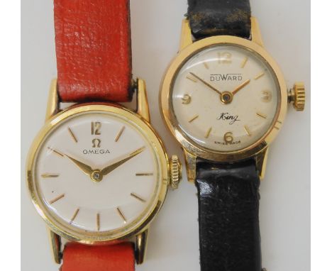 TWO LADIES WATCHES an 18ct gold ladies Duward King watch, diameter of the dial, 1.7cm, with a black leather strap, weight 9gm
