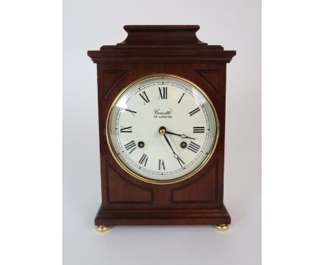 A COMITTI OF LONDON MANTLE CLOCK the wooden case with white dial and Roman numerals, the brass German movement marked FHS, 25