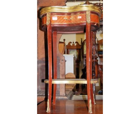 A reproduction French walnut and gilt metal mounted kidney shaped single drawer two-tier side table, having a white marble to