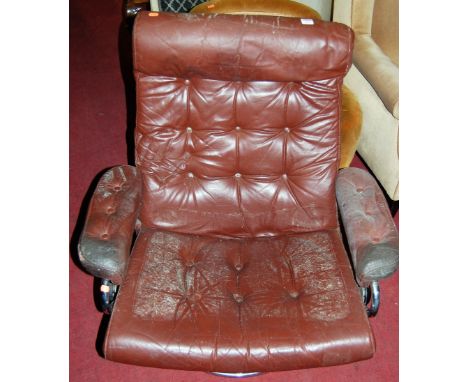 A 1960s tubular chrome and tan leather button upholstered swivel armchair; together with a matching footstool (2) 