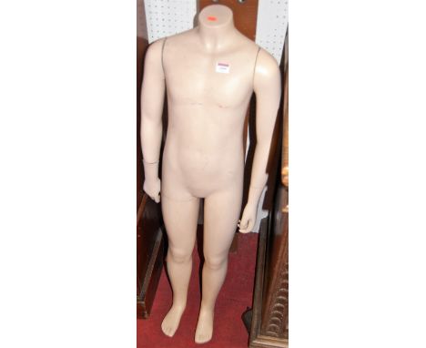 A childs shop display mannequin, with moveable arms, h.110cm