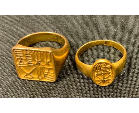 A Chinese 22ct gold signet ring, size R, Chinese hall marks, stamped 22k 19.8g; another yellow metal, size S 7.9g 