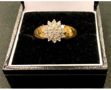 An 18ct gold diamond cluster ring claw set with 19 brilliant cut diamonds with a total carat weight of 0.5cts, size R, 4.4g 