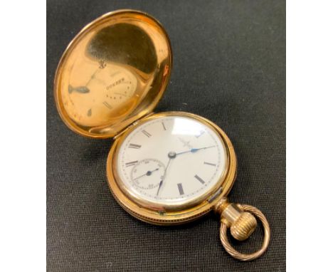 A Elgin National Watch Company hunter cased pocket watch, ornate engraved floral yellow metal case, white enamel dial, Roman 