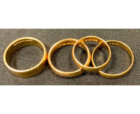 A 22ct gold half barrel wedding band, size M 1/2, London, 1910; another size K, Birmingham, 1960; a 22ct gold flat wedding ba