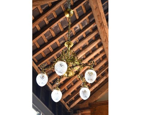 A gilt hanging five branch electrolier with cut glass globe shades, currently 130 cm high (adjustable link suspender) x 60 cm