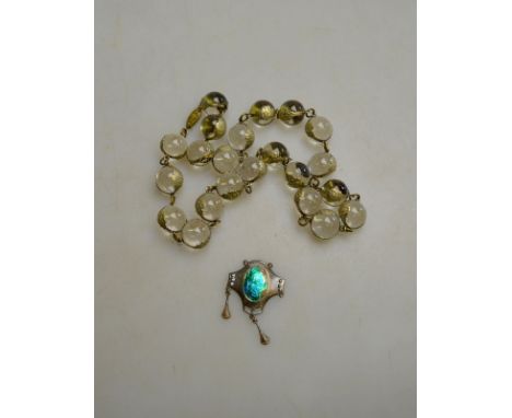 An Arts and Crafts rock crystal sphere necklace to/w a Charles Horner enamel pendant (broken) (2) Condition Report Total appr