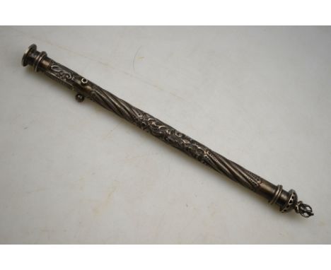 An Edwardian scribe's embossed and chased silver pen holder/desk seal, the hinged cover with two-faced seated Chinaman finial