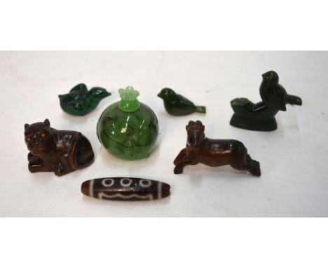 Six small Asian objects, including: two netsuke, each with himotoshi on the base; a malachite bird; and a jade group of two b