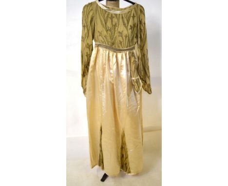 A 1920s pale lemon silk velvet coat with ivory silk lining fastened with a single button, to/w a pale lemon silk satin dress 