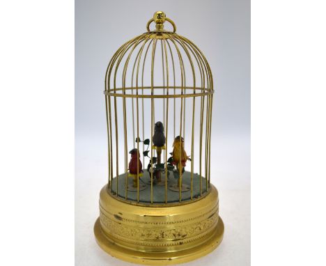 A clockwork automaton bird cage with three chirping birds within with moving heads, 25 cm high
