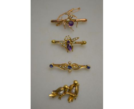 A collection of four interesting brooches including two birds on a branch with freshwater pearl bodies stamped 9ct; amethyst 