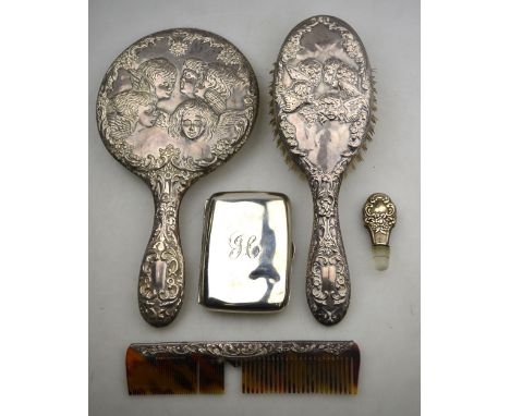 A cherub-embossed silver-backed hand-mirror with hairbrush and comb, Birmingham 1955, to/w an Edwardian cigarette case, Birmi