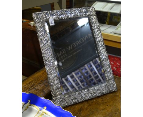 A large Edwardian silver-faced easel toilet mirror with bevelled plate, William Devenport, Birmingham 1907.  49 x 36 cm