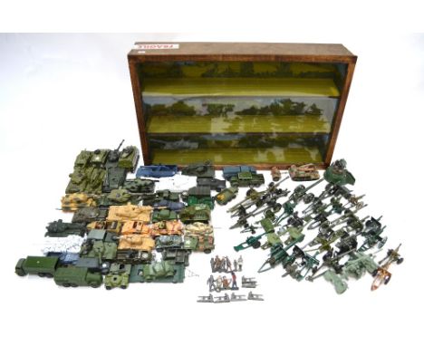 A large collection of unboxed and played-with Dinky, Corgi and other military vehicles, field-guns and related models in thre