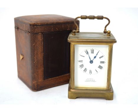 Hawley & Co, Regent Street, London (Examined by) a late 19th century lacquered brass eight-day carriage clock with white enam