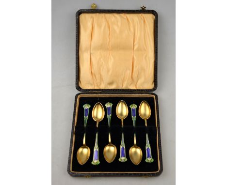 A cased set of six Norwegian Art Nouveau silver gilt and enamel coffee spoons with floral-decorated finials