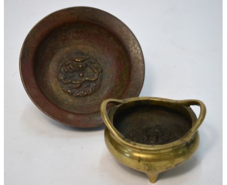 A small gilt metal tripod incense burner with two handles, Xuande six-character mark to both the base and interior, 7.5 cm di
