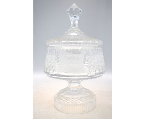 A cut glass stem bowl on cylindrical foot with domed cover and finial, 42 cm. high; inscribed Sutton Scotney 