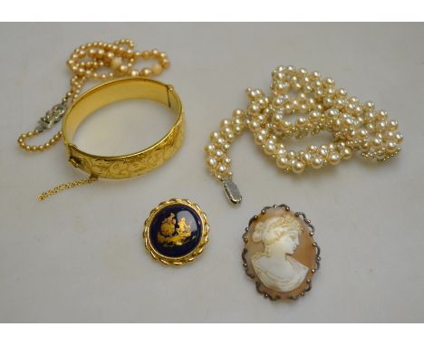 A lot including gilt metal bangle, two rows of imitation pearls, cameo brooch and gilt metal brooch